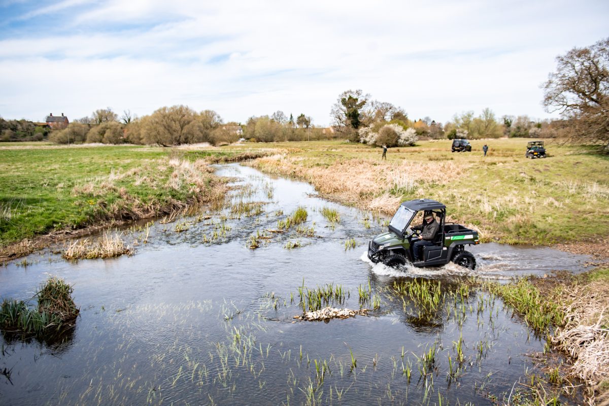 Electric utility vehicle HiSun Sector 5kW driving through water